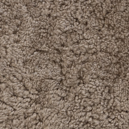 Pouf ovale Bilbury à quatre mains en peau lainée taupe