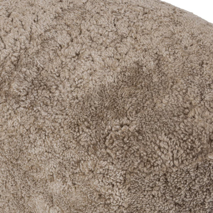 Pouf ovale Bilbury à quatre mains en peau lainée taupe