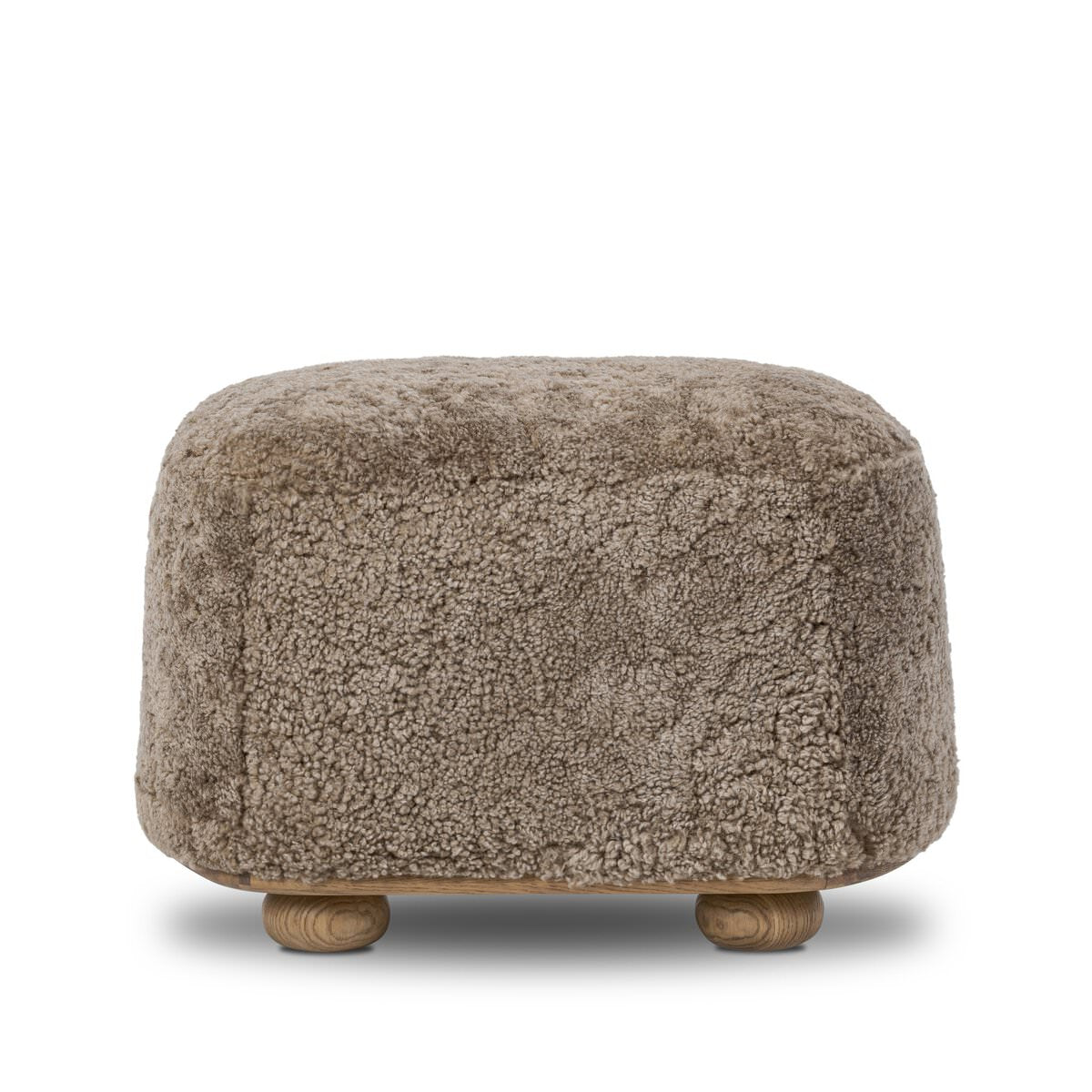 Pouf ovale Bilbury à quatre mains en peau lainée taupe