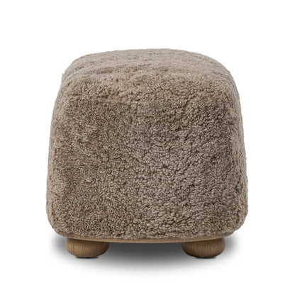 Pouf ovale Bilbury à quatre mains en peau lainée taupe